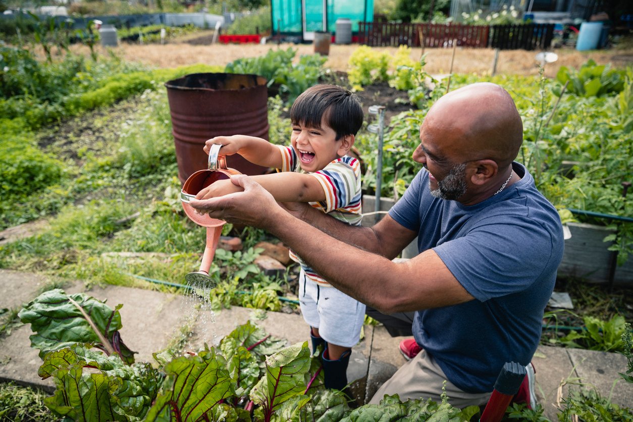 Grandfather and grandson gardening