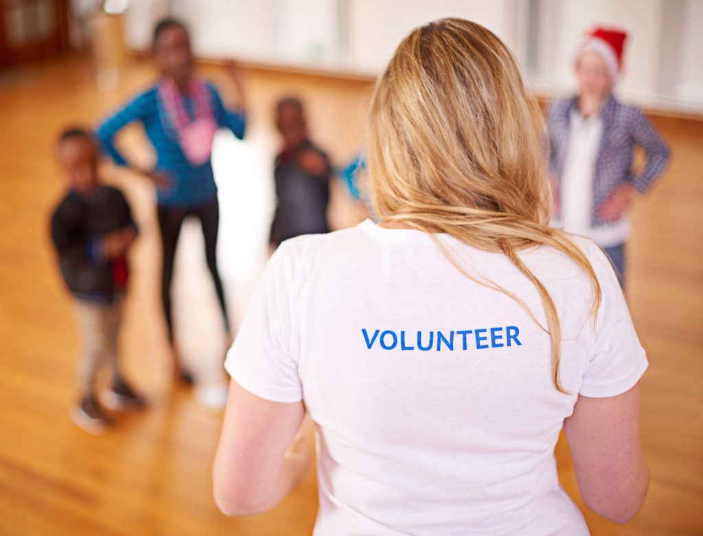 Volunteer working with children